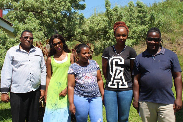 (Left, Mr Mkhize standing with three teachers and Mr Zindela; Handy Man; Department of Public Works).