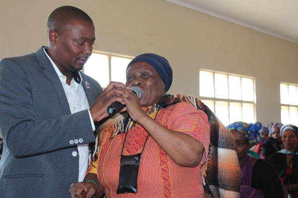 Above: Public Works official, Mr Mthoko Cele assisting elderly Maswazi Mncube who will be receiving a new house in July 2017