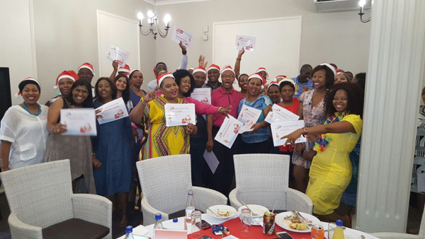 Public Works Employees showing off their certificates