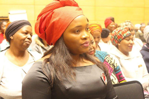 The women listening attentively to speakers