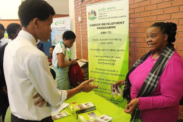 HRD in Action: Mrs T.V. Mkhize engaging with learners during the Career’s Expo at KwaMashu L-Section Hall