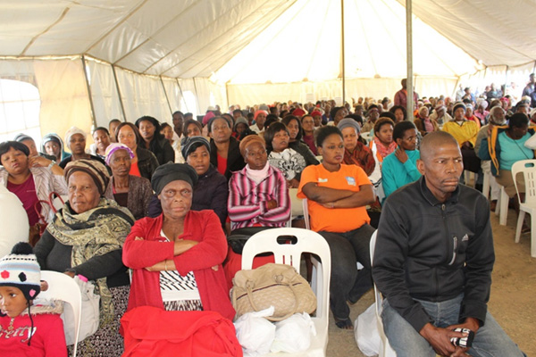 Umlazi community listening attentively to the MECS address