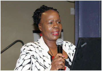 (Above): Mrs Sindi Linda Chief Director for Property Management During the delivery of her keynote address.
