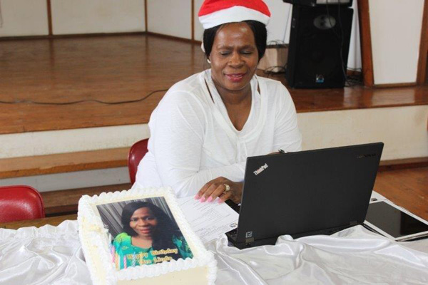 Chief Director: Property Management, Mrs Sindi Linda (above) celebrating her birthday and (below) she is surrounded by her team in celebrating her big day.
