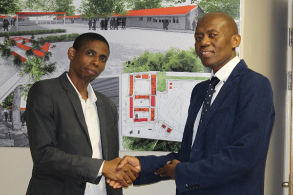 Bidding Farewell: Mr Fitwell Hlatshwayo, ASD Acquisition (left) with Mr PEM Shozi, Deputy Director Immovable Asset Management both from Midlands Region