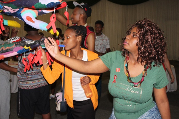 Miss Zethembiso Mthuli - Finance (CFO) Accounting Clerk - and Miss Nombuso Khumalo - Internal Audit & Risk Management – also from Public Works, hanging their message of hope on the tree.