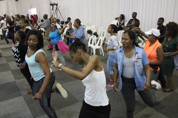 Department of Public Works members exercising during the fitness activities.